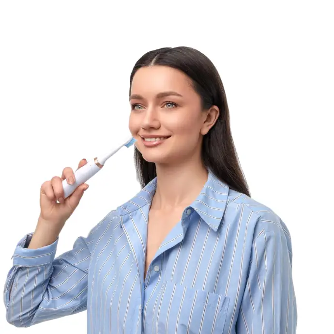 A woman enjoys brushing her teeth