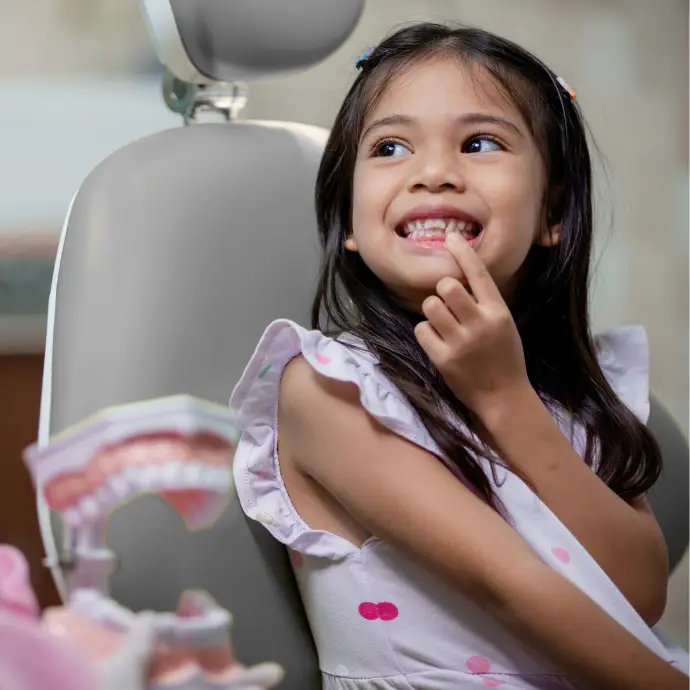 A kid showing what is her dental issue