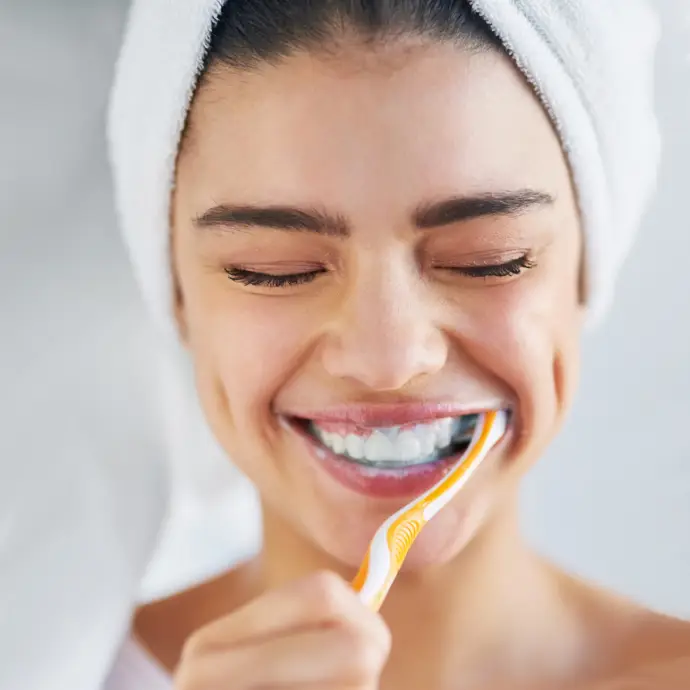 Dental hygienist performing gentle teeth cleaning